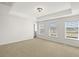 Spacious bedroom with neutral carpet and several windows at 773 Opal Wing St, Moncks Corner, SC 29461