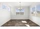 Bright dining room with large windows and a stylish chandelier at 773 Opal Wing St, Moncks Corner, SC 29461