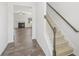 Inviting foyer with wood-look tile flooring and a staircase leading to the second floor at 773 Opal Wing St, Moncks Corner, SC 29461