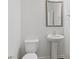 Clean, modern half bathroom with pedestal sink and wood-look tile at 773 Opal Wing St, Moncks Corner, SC 29461