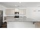 Spacious kitchen island with granite countertops and white cabinetry at 773 Opal Wing St, Moncks Corner, SC 29461