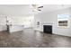 Open concept living area with a fireplace, kitchen island, and dining space at 773 Opal Wing St, Moncks Corner, SC 29461