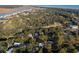 Aerial view of coastal neighborhood with golf course and waterfront property at 900 Fairway Dr, Edisto Island, SC 29438