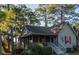 Charming coastal cottage with screened porch nestled among trees at 900 Fairway Dr, Edisto Island, SC 29438