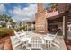 Outdoor patio at the community clubhouse with brick fireplace and seating area at 907 High Nest Ln, James Island, SC 29412