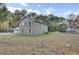 Backyard view of a multi-story home with a stone facade at 100 -102 Sommet Blvd, Summerville, SC 29483