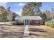 Charming brick house with a teal door and a welcoming walkway at 1001 Lango Ave, Charleston, SC 29407