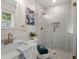 Modern bathroom with glass shower, marble tile, and gold fixtures at 112 Robin Ct, Summerville, SC 29485