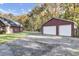 View of the detached two-car garage and side of the house at 1695 Pierpont Avenue, Charleston, SC 29414