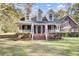 Charming two-story home with a brick and siding exterior, front porch, and landscaped yard at 1695 Pierpont Avenue, Charleston, SC 29414