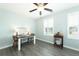 Home office with a desk, chairs, and natural light from shuttered windows at 202 Lab Ct, Moncks Corner, SC 29461