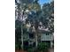 Charming two-story beach house nestled among palm trees at 26 Twin Oaks Ln, Isle of Palms, SC 29451