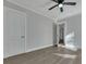 Spacious bedroom with gray walls, wood-look flooring, and ample natural light at 2675 Houston St, North Charleston, SC 29405