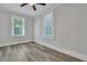 Bright bedroom with wood-look floors, white trim and large windows at 2675 Houston St, North Charleston, SC 29405