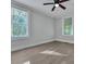 Bright bedroom with two large windows, a ceiling fan, and gray walls at 2675 Houston St, North Charleston, SC 29405