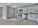 Bright kitchen with white cabinets, stainless steel appliances, and granite countertops at 2675 Houston St, North Charleston, SC 29405