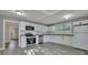 Updated kitchen with white shaker cabinets, stainless steel appliances, and granite countertops at 2675 Houston St, North Charleston, SC 29405
