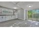 Updated kitchen with white cabinets, granite countertops, and sliding glass door at 2675 Houston St, North Charleston, SC 29405