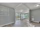 Sunroom with sliding glass doors, large windows, and gray walls at 2675 Houston St, North Charleston, SC 29405