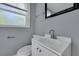 Clean bathroom with white vanity, modern fixtures, and a window at 2754 Houston St, North Charleston, SC 29405