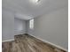 Cozy bedroom with wood-look flooring and ample natural light at 2754 Houston St, North Charleston, SC 29405
