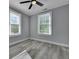 Bright bedroom featuring wood-look flooring and multiple windows at 2754 Houston St, North Charleston, SC 29405