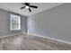 Inviting bedroom with a ceiling fan and wood-look flooring at 2754 Houston St, North Charleston, SC 29405