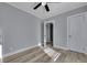 Spacious bedroom with wood-look flooring and access to another room at 2754 Houston St, North Charleston, SC 29405