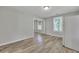 Dining room with wood-look flooring and a view to another room at 2754 Houston St, North Charleston, SC 29405
