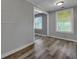 Dining room with wood-look flooring, doorway and window at 2754 Houston St, North Charleston, SC 29405