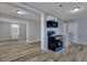 Kitchen with black and blue appliances, white cabinets and wood-look flooring at 2754 Houston St, North Charleston, SC 29405