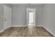 Living room with wood-look flooring, and doorways to adjacent rooms at 2754 Houston St, North Charleston, SC 29405