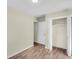 Empty bedroom with an open closet, wood-look flooring, and neutral paint at 3 Summit Ave, Goose Creek, SC 29445