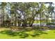 Waterfront picnic area with picnic tables, surrounded by trees, offers a tranquil setting at 3699 Codorus Ct, Mount Pleasant, SC 29466