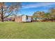 Backyard with green lawn, trees, and a small building at 442 Annette Dr, Goose Creek, SC 29445