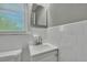 Bathroom with white tile, vanity sink, and window at 442 Annette Dr, Goose Creek, SC 29445