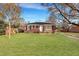 Single-story brick home with fenced yard and mature trees at 442 Annette Dr, Goose Creek, SC 29445