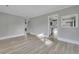 Living area with wood-look floors, gray walls, and view of kitchen at 442 Annette Dr, Goose Creek, SC 29445