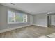 Living room featuring wood-look flooring, a large window, and neutral walls at 442 Annette Dr, Goose Creek, SC 29445