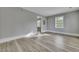 Bright living room with wood-look flooring and neutral gray walls at 442 Annette Dr, Goose Creek, SC 29445