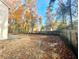 Spacious backyard with a concrete patio and a wooden retaining wall at 518 Fleming Rd, Charleston, SC 29412