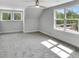 Bright, airy bedroom with large windows, neutral decor, and gray carpet at 518 Fleming Rd, Charleston, SC 29412