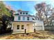 Inviting two-story white home with covered porch and attached two-car garage at 518 Fleming Rd, Charleston, SC 29412