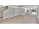 Open living area with wood-look flooring, staircase, and view into kitchen at 518 Fleming Rd, Charleston, SC 29412