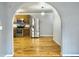 View of the kitchen through an archway, featuring stainless steel appliances at 6713 Augusta Hwy, Smoaks, SC 29481