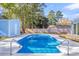 Relaxing pool area with a new wooden deck and fenced yard at 7731 Barclay Ave, North Charleston, SC 29418