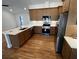 Updated kitchen featuring stainless appliances, ample counter space, and wooden cabinetry at 923 Godber St, Charleston, SC 29412