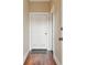 Entryway with white door, dark wood floors, and a welcome mat at 1 Bennett St # 2, Charleston, SC 29401