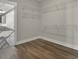 Walk-in closet with wire shelving and wood-style flooring; adjacent bathroom visible at 112 Crosscut Ln, Summerville, SC 29486