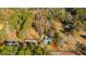 Aerial view of a house on a lot with mature trees and a road at 1305 Sandy Run Cir, Summerville, SC 29486